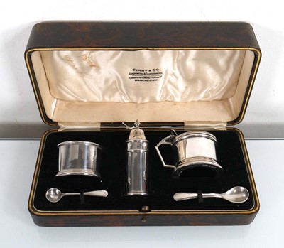 Lot 385 - An early 20th century silver three piece cruet...