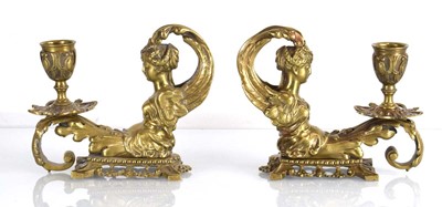 Lot 135 - A pair of late 19th century brass figural...