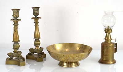 Lot 137 - A pair of brass candlesticks with claw feet on...