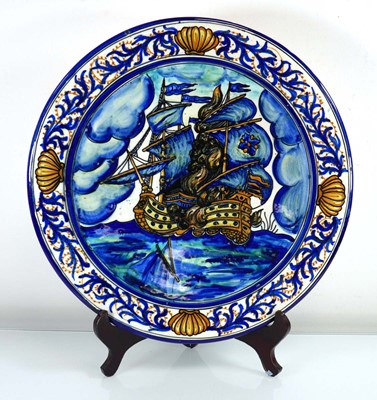 Lot 333 - A majolica charger decorated with a sailing...