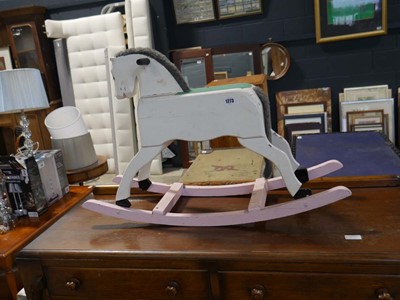 Lot 1273 - Wooden rocking horse painted in pink and white