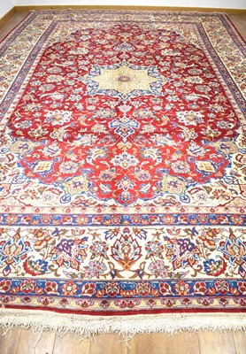 Lot 6 - A late 20th century carpet with a central...