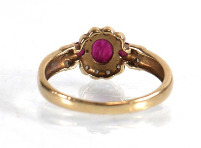 Lot 599 - A 9ct yellow gold ring set three small rubies...