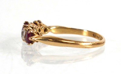 Lot 600 - An 18ct yellow gold ring set three rubies...