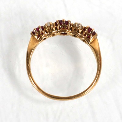 Lot 600 - An 18ct yellow gold ring set three rubies...