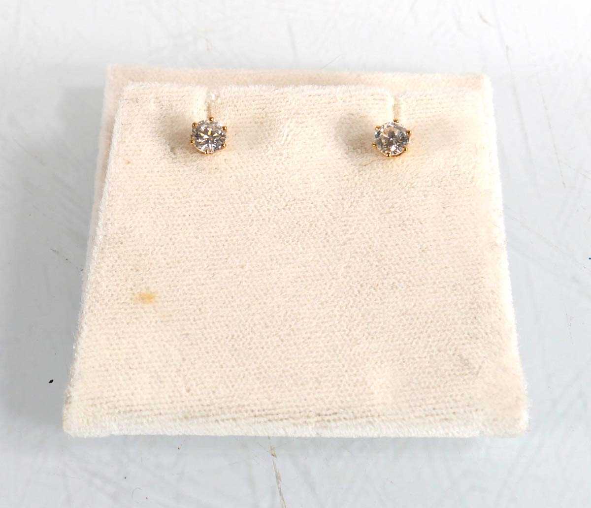 Lot 604 - A pair of 18ct yellow gold ear studs, each set...