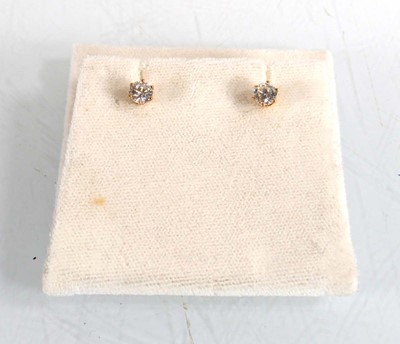 Lot 604 - A pair of 18ct yellow gold ear studs, each set...