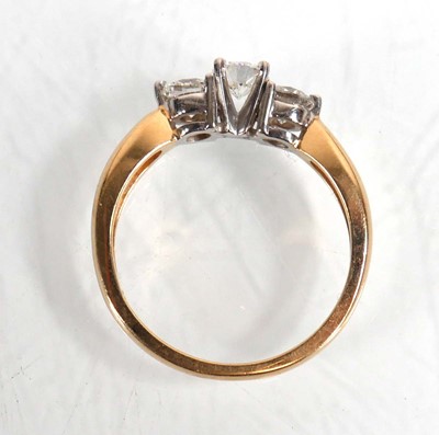 Lot 608 - A 14ct yellow gold ring set three brilliant...