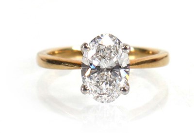 Lot 609 - A yellow metal ring set oval lab grown diamond...