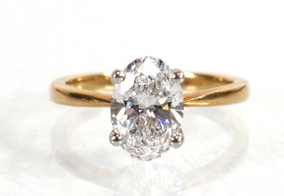 Lot 609 - A yellow metal ring set oval lab grown diamond...