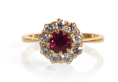 Lot 612 - An 18ct yellow gold cluster ring set round cut...