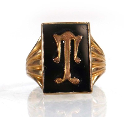 Lot 615 - A 9ct yellow gold signet ring set black...