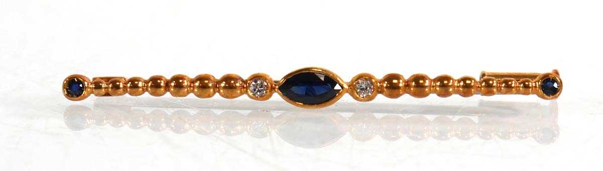 Lot 636 - An 18ct yellow gold bar brooch set marquise...