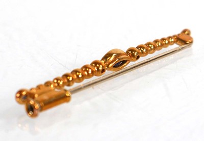 Lot 636 - An 18ct yellow gold bar brooch set marquise...