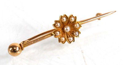 Lot 640 - A yellow metal bar brooch set seed pearls in a...