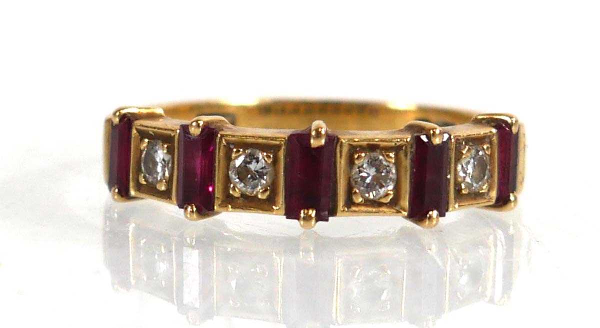 Lot 646 - An 18ct yellow gold half eternity ring set...