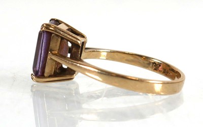 Lot 647 - A 9ct yellow gold ring set rectangular cut...