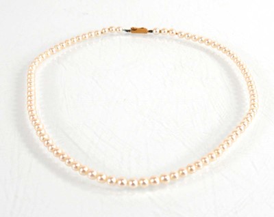 Lot 657 - A single strand cultured pearl necklace with...