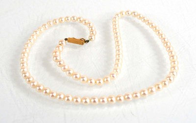 Lot 657 - A single strand cultured pearl necklace with...