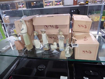 Lot 2239 - 7 boxed Lladro Nao porcelain figures