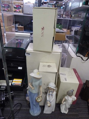 Lot 2242 - 4 boxed Lladro Nao porcelain figures