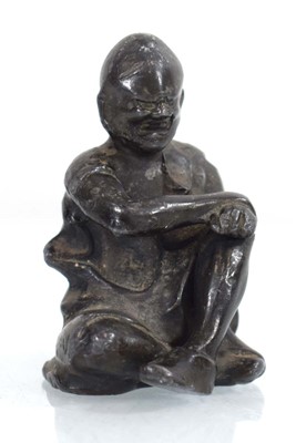 Lot 80 - A lead figure modelled as a seated man wearing...