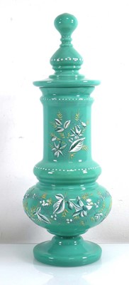 Lot 343 - An early/mid 20th century pale green glass jar...