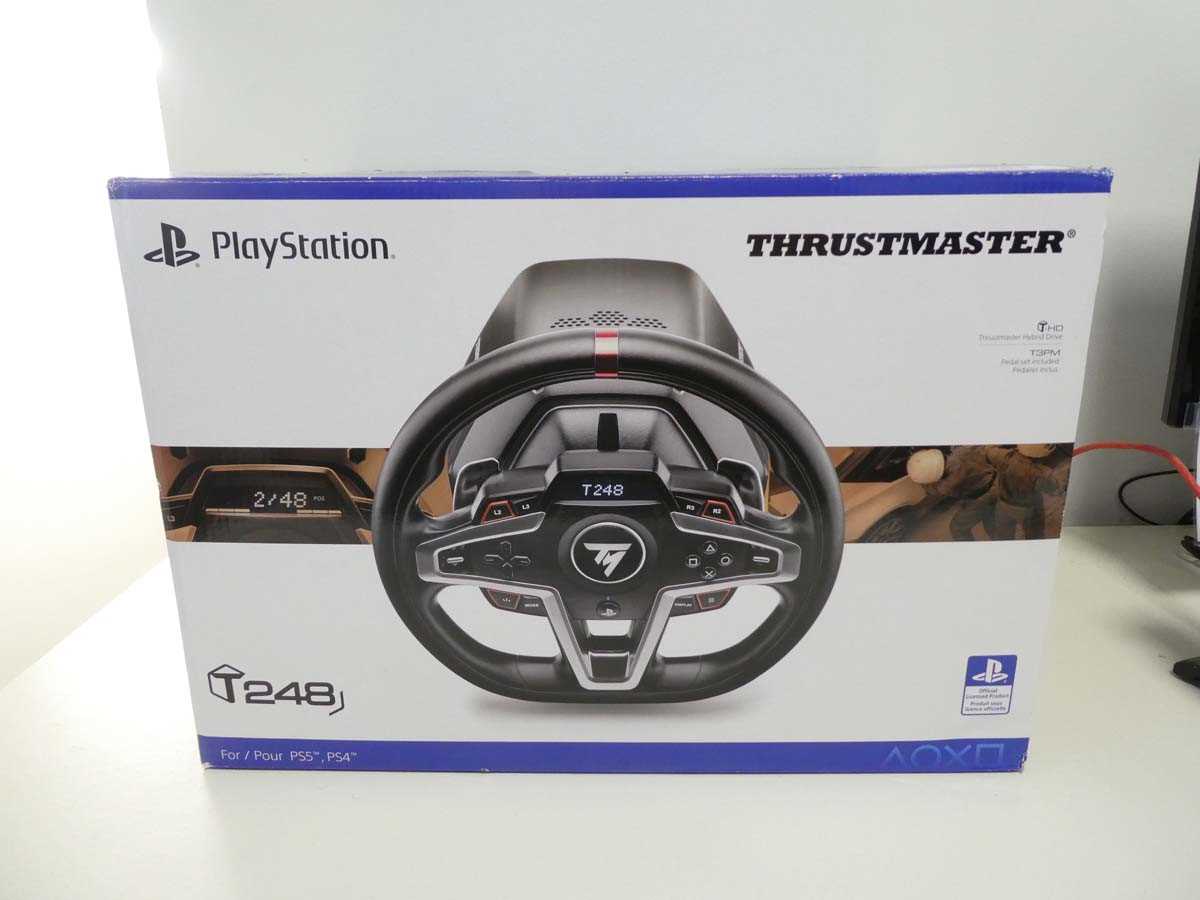 Lot Thrustmaster T248 racing wheel and pedal set...