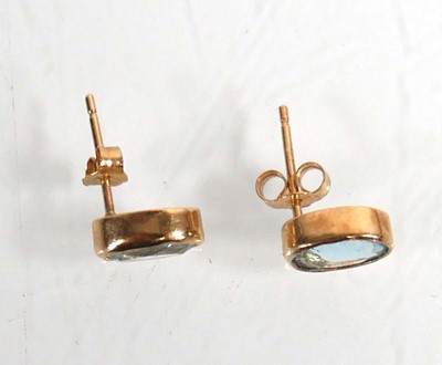 Lot 624 - A pair of 9ct yellow gold ear studs, each set...