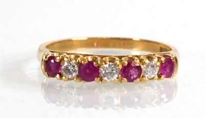 Lot 670 - An 18ct yellow gold half eternity ring set...