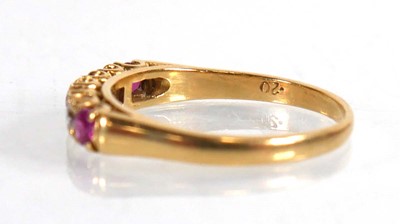 Lot 670 - An 18ct yellow gold half eternity ring set...