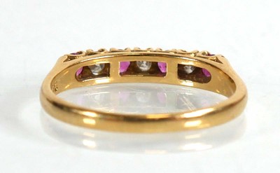 Lot 670 - An 18ct yellow gold half eternity ring set...