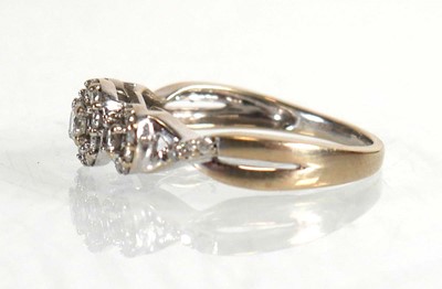 Lot 672 - An 18ct white gold ring set three diamonds...