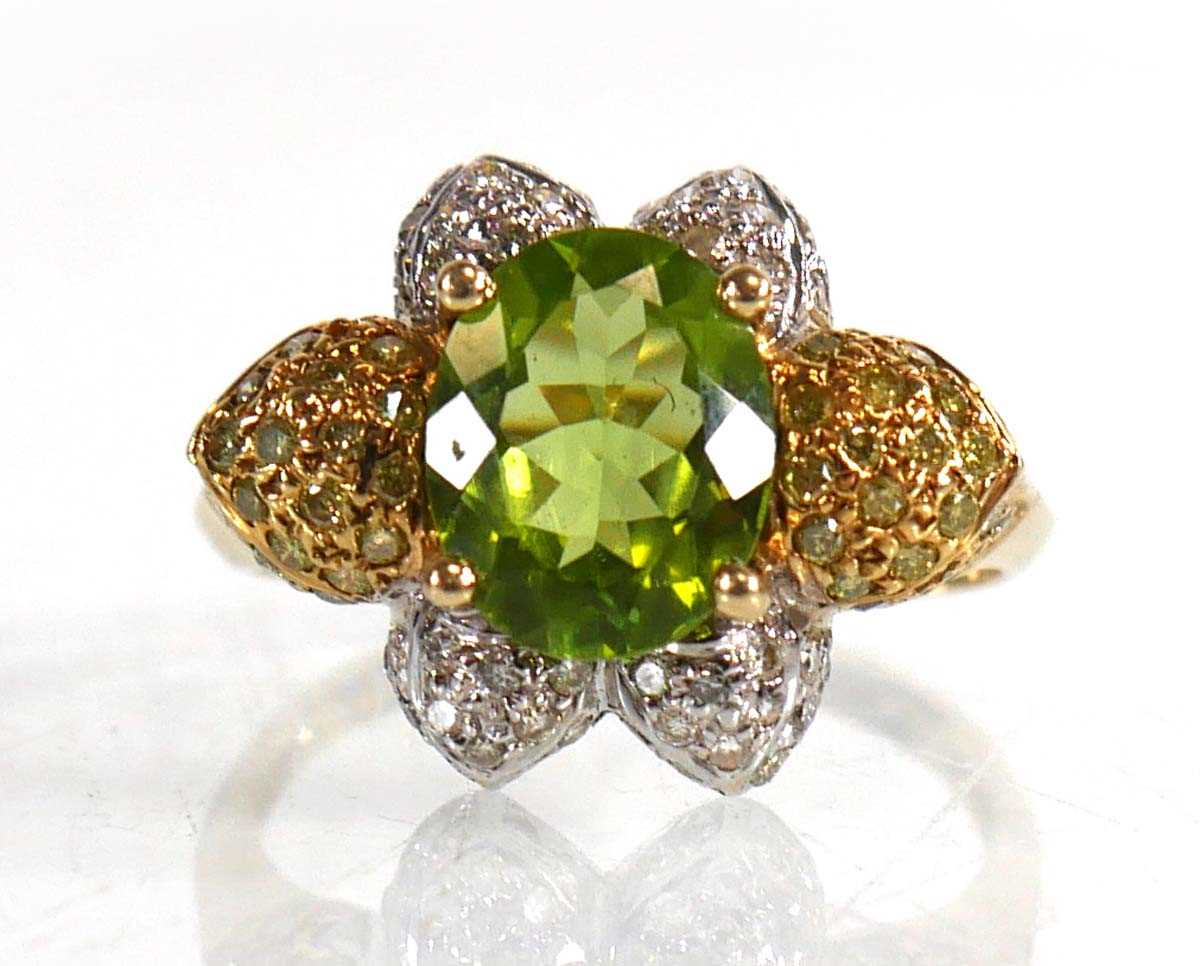 Lot 675 - A 14ct yellow gold ring set oval green stone...