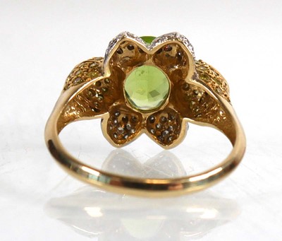 Lot 675 - A 14ct yellow gold ring set oval green stone...