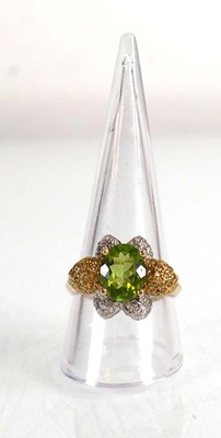 Lot 675 - A 14ct yellow gold ring set oval green stone...