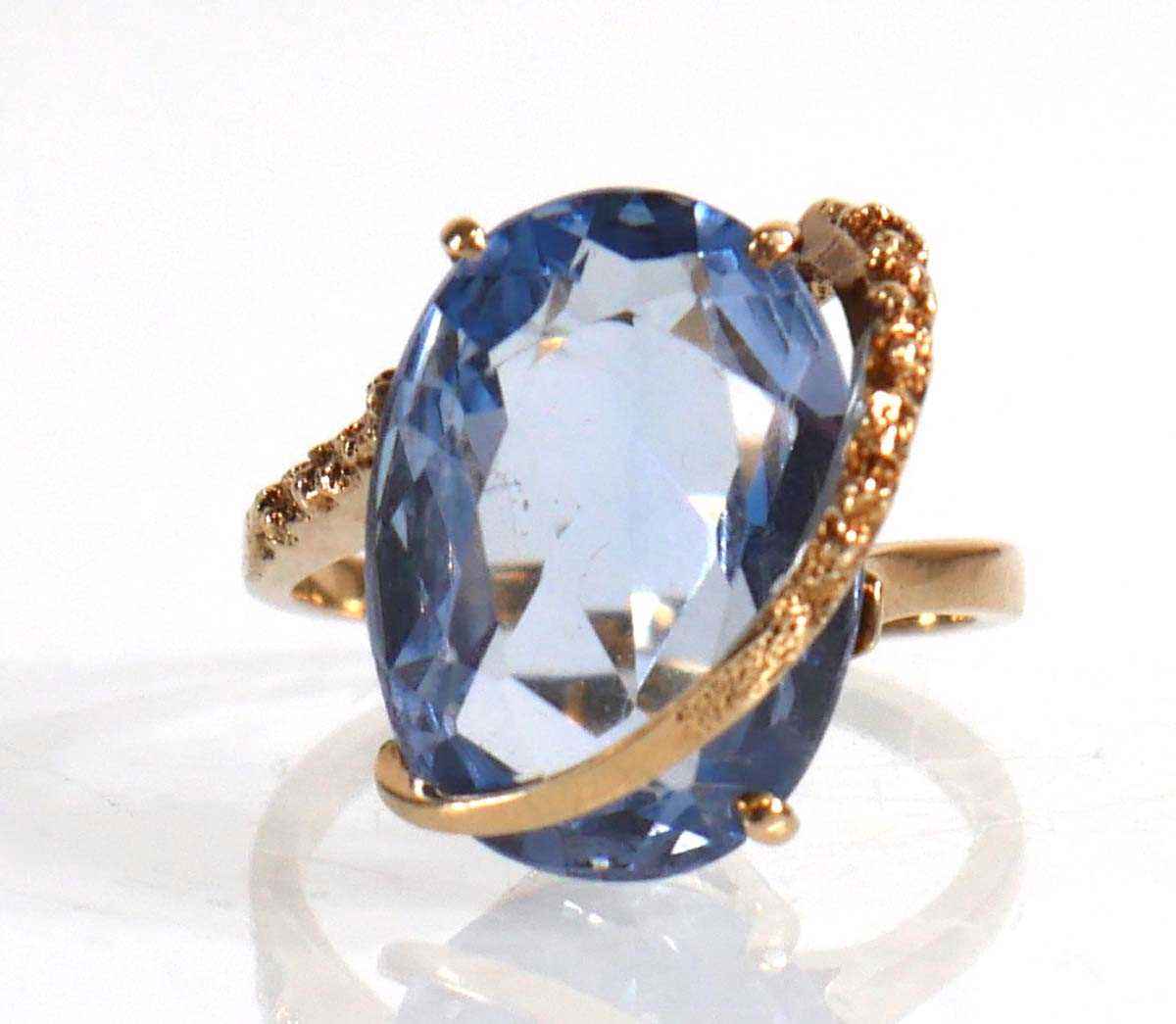 Lot 677 - A 10ct yellow gold ring set marquise cut pale...