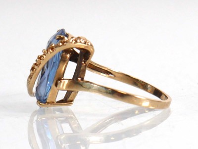 Lot 677 - A 10ct yellow gold ring set marquise cut pale...