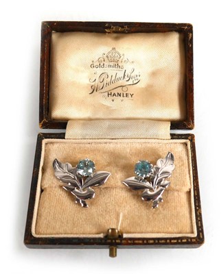 Lot 681 - A pair of white metal ear studs, each of...