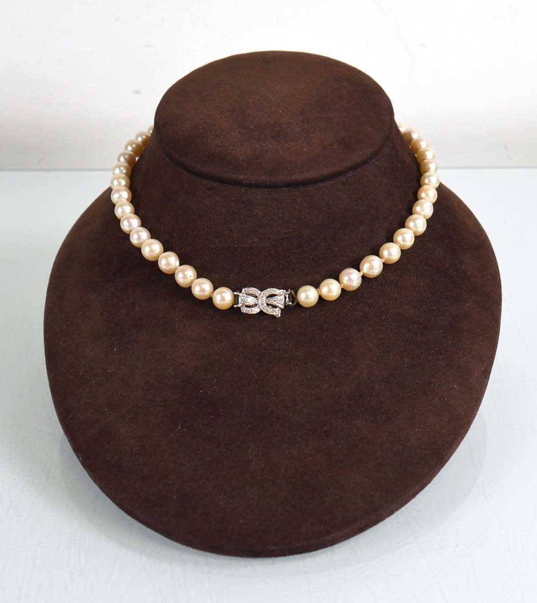 Lot 683 - A single strand cultured pearl necklace with...