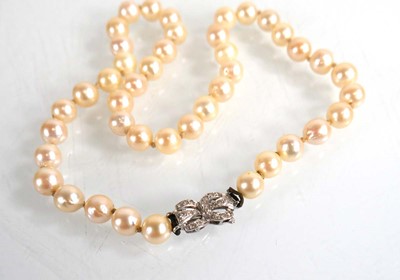 Lot 683 - A single strand cultured pearl necklace with...