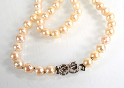 Lot 683 - A single strand cultured pearl necklace with...