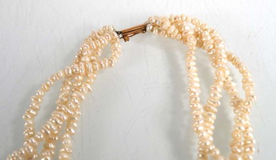 Lot 684 - A four strand pearl necklace with central...