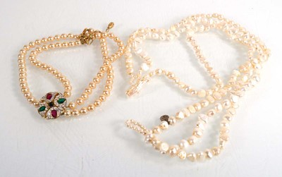 Lot 688 - A triple strand pearl necklace and an...