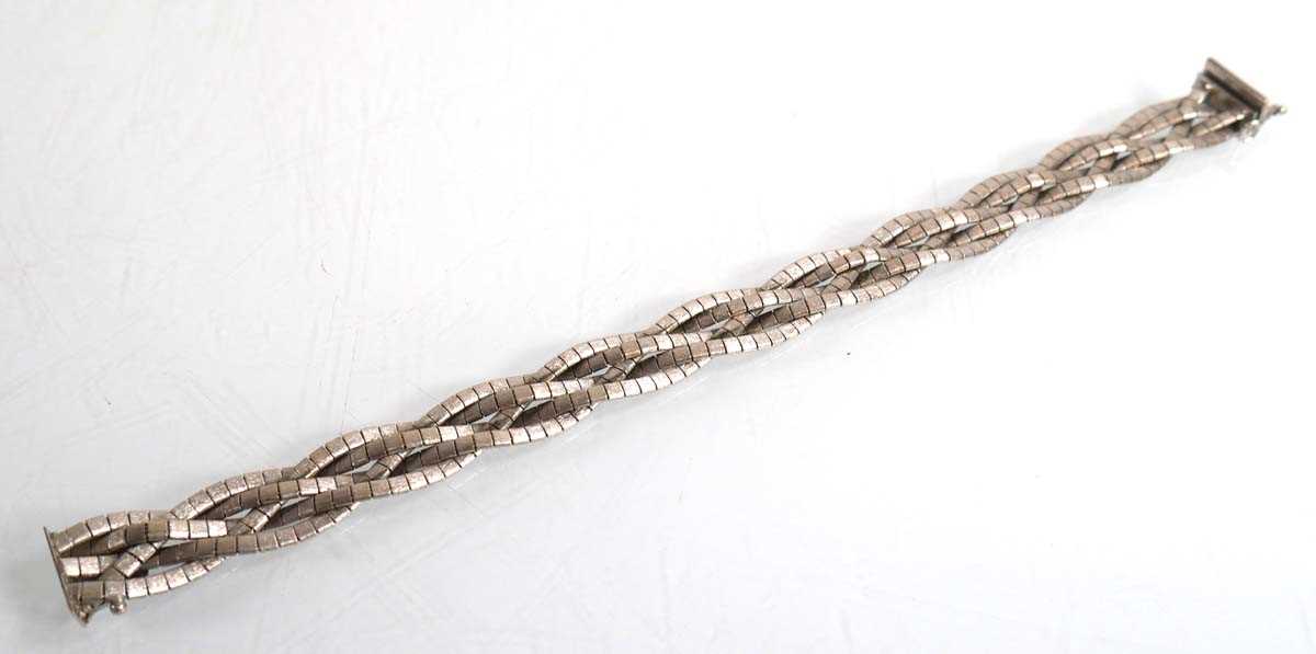 Lot 692 - An 18ct white gold plaited link bracelet, l....