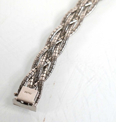 Lot 692 - An 18ct white gold plaited link bracelet, l....