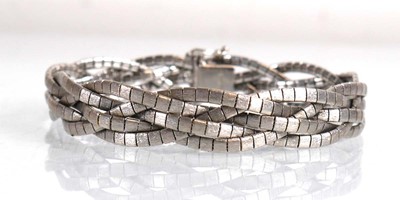 Lot 692 - An 18ct white gold plaited link bracelet, l....