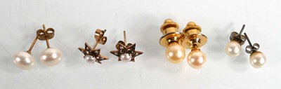 Lot 696 - A pair of 14ct yellow gold ear studs of star...