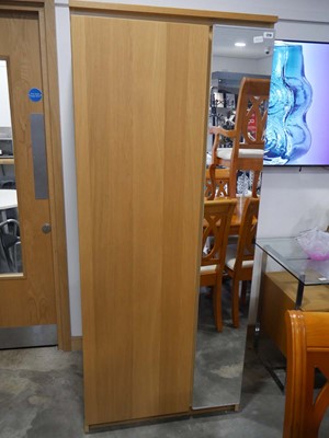 Lot 1210 - Modern light oak finish single door wardrobe...