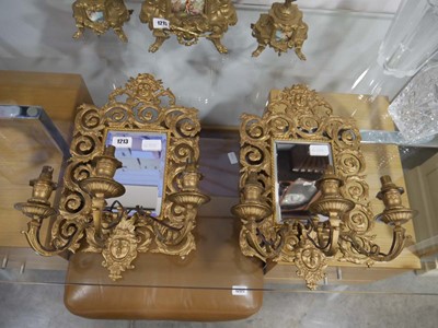 Lot 1213 - Pair of mirror back gilt framed wall sconces